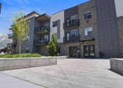 Thumbnail 10 of 136 - a view of the front of the building at The Flats at Riverwoods, Provo, Utah