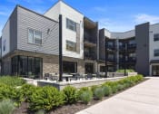 Thumbnail 9 of 136 - a view of the building from the outside at The Flats at Riverwoods, Provo