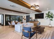 Thumbnail 50 of 136 - a living room filled with furniture and a large window at The Flats at Riverwoods, Provo, Utah