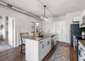Thumbnail 69 of 84 - an open kitchen and dining area with a large counter top at The Revival, Salt Lake City Utah