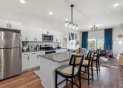 Thumbnail 63 of 84 - an open kitchen and dining area with a stainless steel refrigerator at The Revival, Salt Lake City