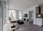 Thumbnail 3 of 22 - a living room with a white couch and a coffee table