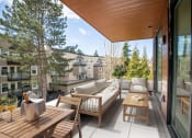 Thumbnail 14 of 22 - a terrace with couches and tables