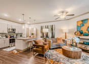 Thumbnail 22 of 27 - A modern kitchen with a dining area and a living room at Atlas Point at Prestonwood Apartments , Carrollton, 75010