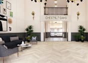 Thumbnail 26 of 29 - Elegant lobby with modern lighting and reception desk at Chestnut Oaks Apartments, Fort Washington, MD 20744