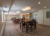 Thumbnail 4 of 11 - a large dining room with a large table and chairs
