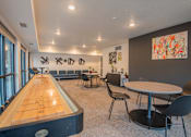 Thumbnail 2 of 12 - A room with a pool table and chairs.