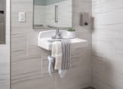 Thumbnail 52 of 52 - a white bathroom with a sink and a mirror
