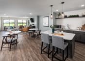 Thumbnail 38 of 52 - an open kitchen and living room with a table and chairs