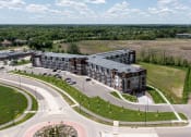 Thumbnail 20 of 52 - an aerial view of an apartment building next to a road