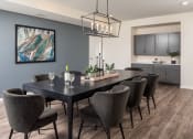 Thumbnail 24 of 52 - an image of a dining room with a table and chairs