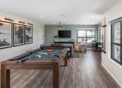 Thumbnail 41 of 52 - a games room with a pool table and a tv