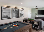 Thumbnail 1 of 52 - a games room with a pool table and a tv