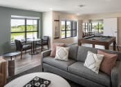 Thumbnail 10 of 52 - a living room with a couch and a pool table
