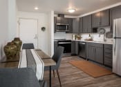 Thumbnail 46 of 52 - a kitchen and dining room with a table and chairs