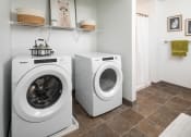 Thumbnail 39 of 52 - a washer and dryer in a laundry room with a shower and a shelf