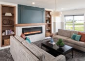 Thumbnail 4 of 52 - the preserve at gateway living room with couches and a fireplace