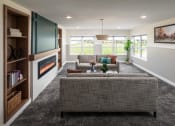 Thumbnail 7 of 52 - a living room with a couch and a fireplace