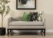 Thumbnail 31 of 52 - a couch with colorful pillows and a painting on the wall