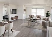 Thumbnail 1 of 15 - A modern living room with a wooden floor and furniture.
