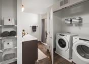 Thumbnail 24 of 25 - a washer and dryer in a laundry room with a sink and a closet