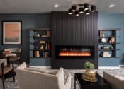 Thumbnail 1 of 25 - a living room with furniture and a fireplace