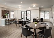 Thumbnail 21 of 24 - A modern dining room with a large table and chairs.