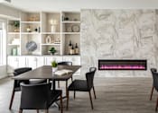 Thumbnail 10 of 24 - A modern dining room with a table set for four.