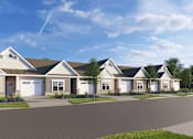 Thumbnail 7 of 8 - A row of houses with a clear blue sky above them.