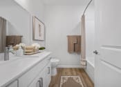 Thumbnail 17 of 43 - a bathroom with a sink and a toilet and a shower