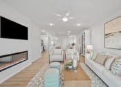 Thumbnail 8 of 43 - a living room with a couch and a fireplace