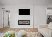 Thumbnail 27 of 43 - a living room with a fireplace and a tv on the wall