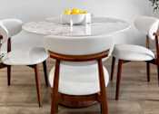 Thumbnail 25 of 62 - A dining table with chairs and a bowl of lemons on it.