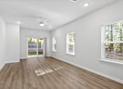 Thumbnail 5 of 62 - A room with wooden flooring and white walls.