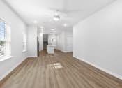 Thumbnail 10 of 62 - A room with wooden flooring and white walls.