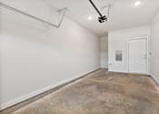 Thumbnail 12 of 62 - A room with a white door and a white wall.