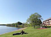 Thumbnail 14 of 19 - A large body of water with a building in the background.