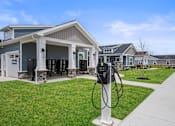 Thumbnail 29 of 39 - A charging station for electric vehicles is located in front of a building.