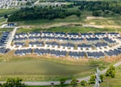 Thumbnail 29 of 29 - A large housing development with a lake in the middle.