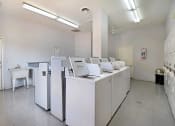 Thumbnail 9 of 13 - Belaire Manor's laundry room features a number of clothes washers and dryers for your convenience.