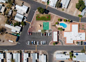 Thumbnail 5 of 10 - A view of a street with cars and buildings.