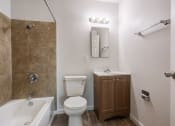 Thumbnail 26 of 28 - a bathroom with a toilet sink and bathtub