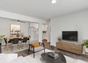 Thumbnail 2 of 28 - a living room with white walls and a large tv on top of a wooden cabinet