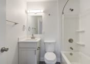 Thumbnail 27 of 28 - a bathroom with a sink toilet and bathtub