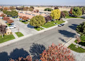 Thumbnail 14 of 15 - an aerial view of a parking lot with cars and trees