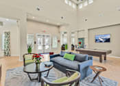 Thumbnail 3 of 20 - a resident clubhouse with a pool table and couches