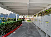 Thumbnail 2 of 8 - A long corridor with electrical boxes on the side.