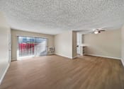 Thumbnail 11 of 22 - A room with wooden flooring and a ceiling fan.