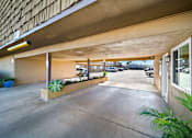 Thumbnail 8 of 9 - A parking garage with a concrete floor and a concrete ceiling.