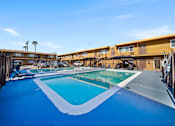 Thumbnail 6 of 9 - A swimming pool with a blue tinted water.